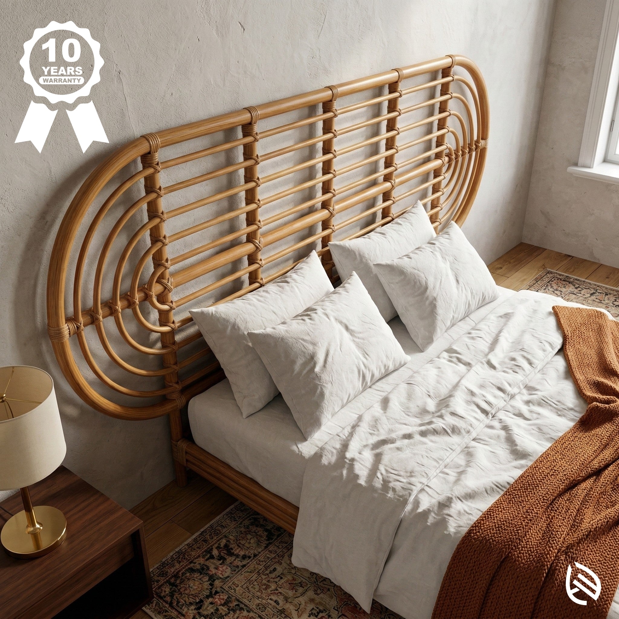 Bed with a rattan headboard in a room with a lamp and rug.