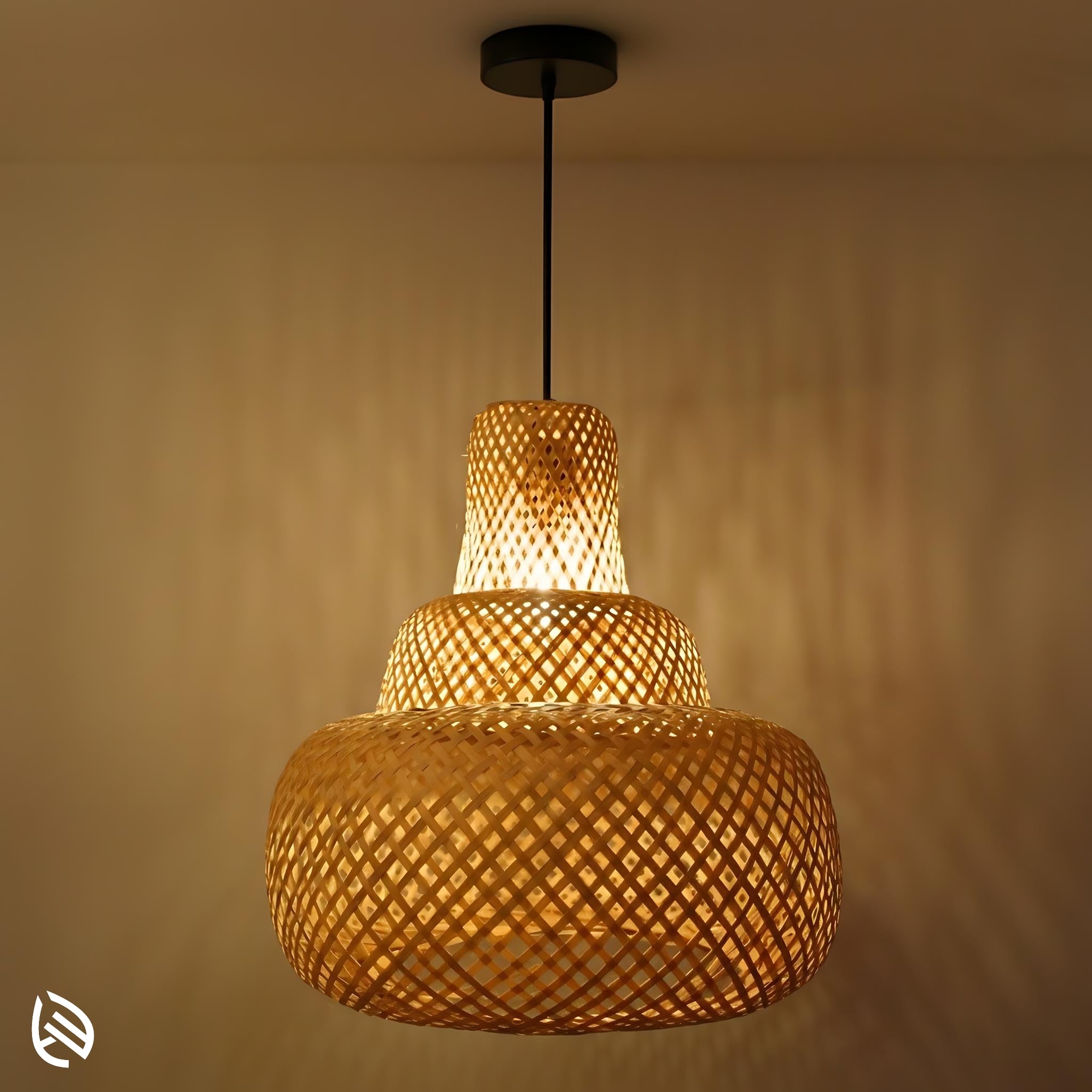 Sereni Glow pagoda bamboo pendant lit; three-tier lattice casting soft wall shadows, black canopy.