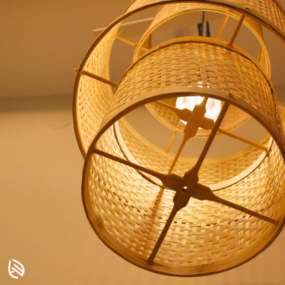 Underside detail: bamboo cross stays and E27 bulb inside stacked cane drums of Artisan Aura pendant.