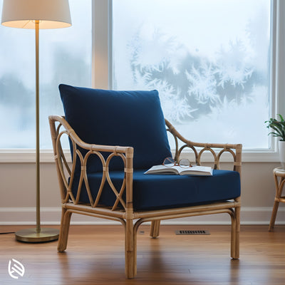 Rattan chair with navy cushions in cozy reading nook