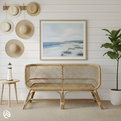 Natural rattan loveseat in coastal living room, open lattice back and rounded arms