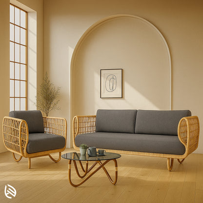 Curved-frame natural rattan sofa set with dark grey cushions, includes a three-seater and single armchair for modern interiors