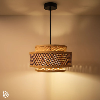 Double Layer bamboo hanging lamp lit; tiered cane drum shade with up-and-down glow and black canopy.