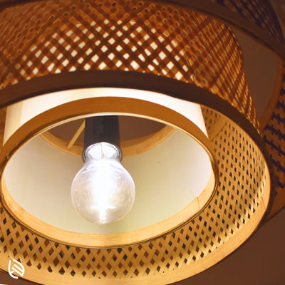 Close-up from below: Double Layer pendant with E27 bulb, concentric bamboo rings and inner diffuser.