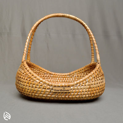 Front view of Breezy Bin compact dip‑belly rattan tray with curved handle