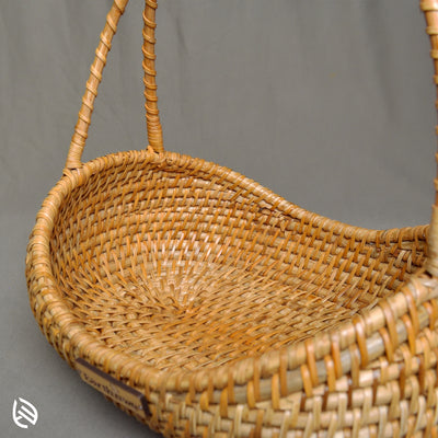 Close-up of woven texture and curved handle on Breezy Bin basket