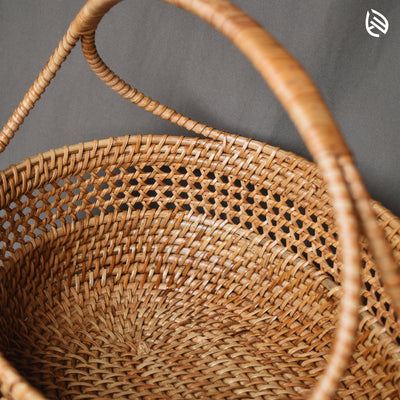 Lifestyle photo of Clutter Keeper basket holding fruits near sunlight