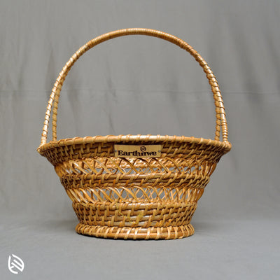 Rooted Bloom curved handle rattan basket front view