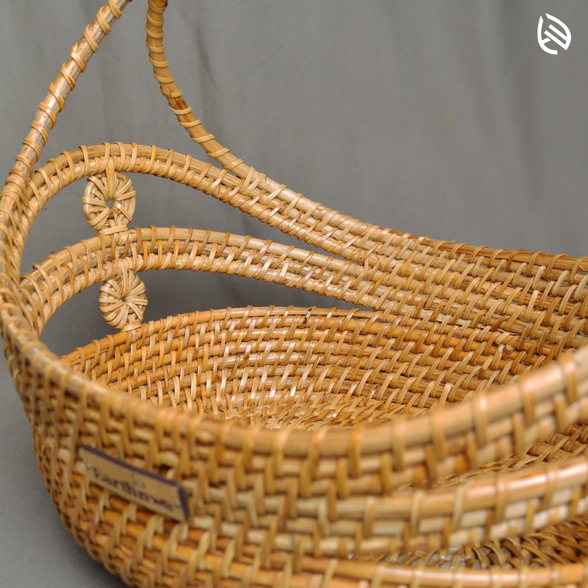 Close-up of arch handle and layered weave on the Stock Keeper basket