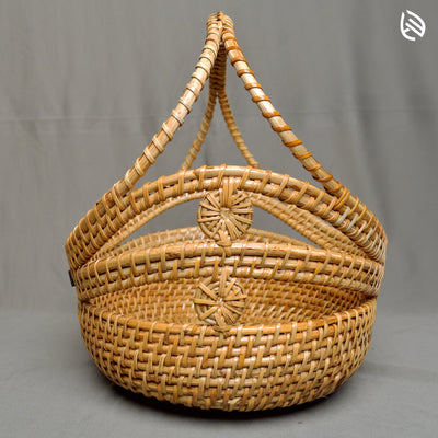 Detailed view of cutout pattern and rattan texture near handle base