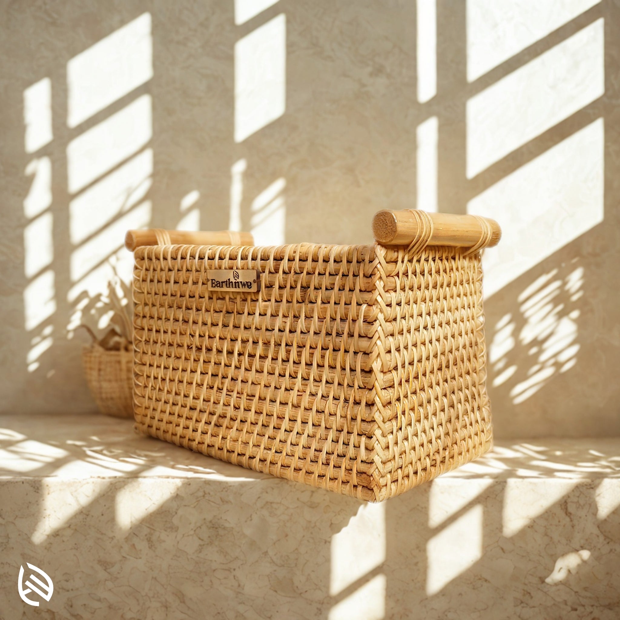 Natural woven rattan organizer on window ledge in sunlight