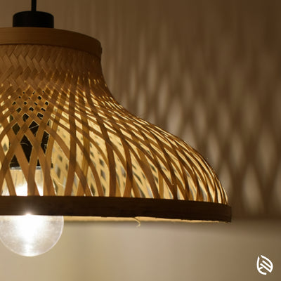 Close-up of EcoLoom woven bamboo lattice and wave shade with E27 bulb; natural cane texture.