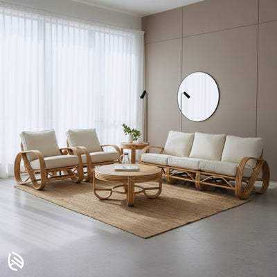 Minimal modern interior featuring Fusion Rattan Sofa Set on a jute rug by sheer curtains; sustainable natural rattan with plush cushions.
