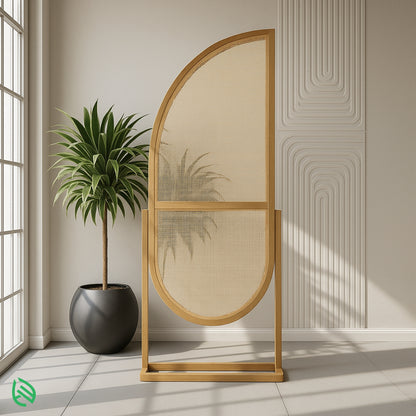 Golden Arc arched rattan room divider by window; handwoven cane, wooden frame, tray base.