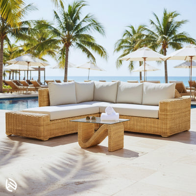 Outdoor poolside scene with L Shaped Rattan Sofa Set in natural rattan and glass table - resort-style patio seating.