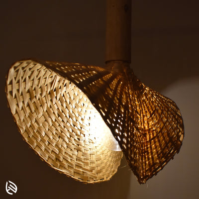 Detailed weave texture of bamboo lampshade glowing