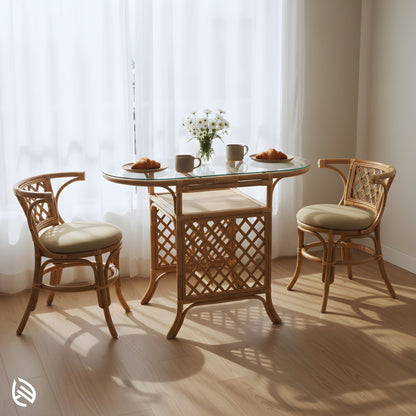 Bright dining corner with Twisted Twine rattan 2-seater - oval glass-top table styled with daisies, mugs, and croissants.