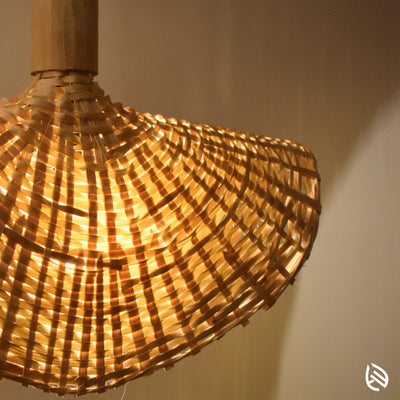 Close-up of split-bamboo lattice shade with warm bulb