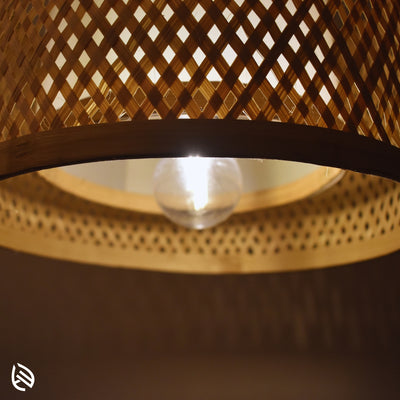 Underside close-up showing E27 bulb and bamboo rim inside Minimal Nest drum shade.
