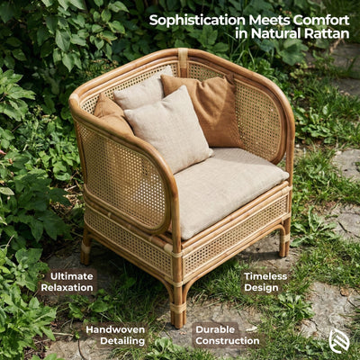 Rattan chair with cushions in a natural setting, emphasizing comfort and design.