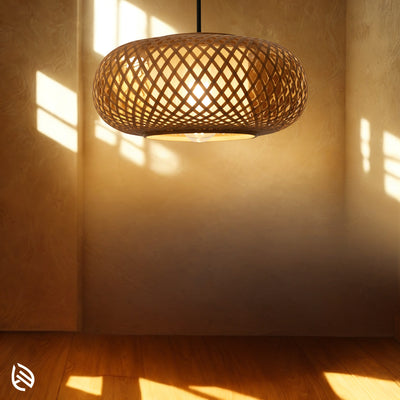 Sunlit room with Oval Cage bamboo ceiling pendant casting warm natural light onto wood floor.