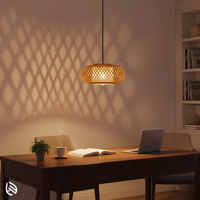 Bamboo pendant over work desk casting diamond shadow patterns on wall, Oval Cage design.