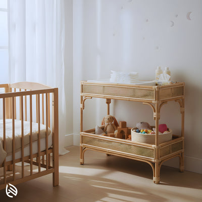 Quirky Rattan Trendy Table used as a nursery changing/organizing station - two-shelf natural rattan console beside a crib in a bright room.