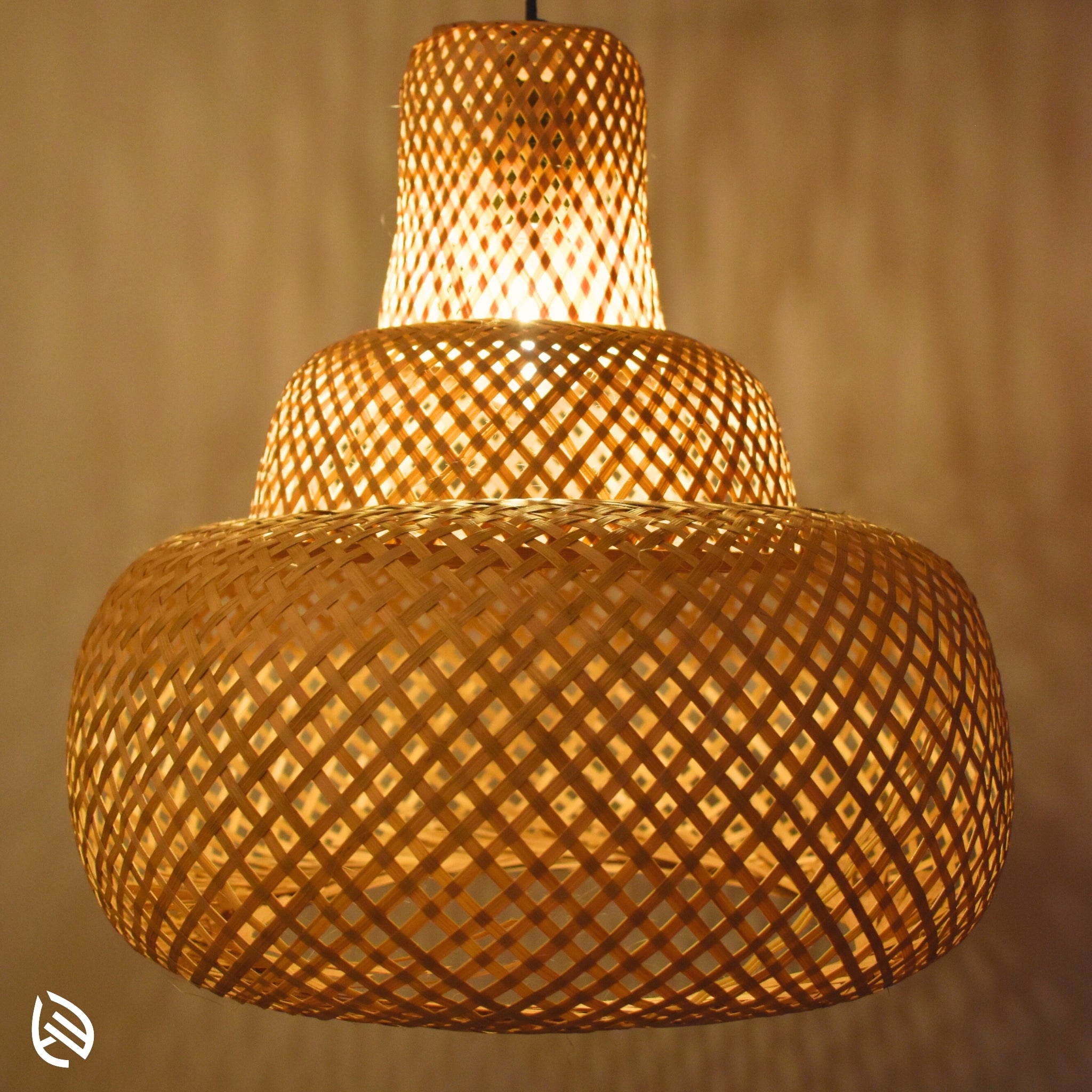 Close-up of woven bamboo lattice on Sereni Glow pendant; layered three-tier texture glowing.