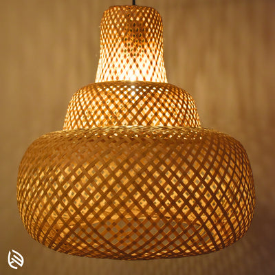 Close-up of woven bamboo lattice on Sereni Glow pendant; layered three-tier texture glowing.