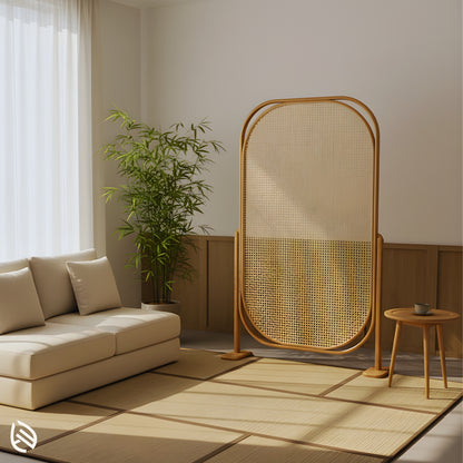 freestanding oval cane partition beside sofa and bamboo plant