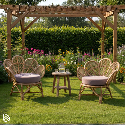 Pair of tulip-back rattan chairs outdoors in garden setting
